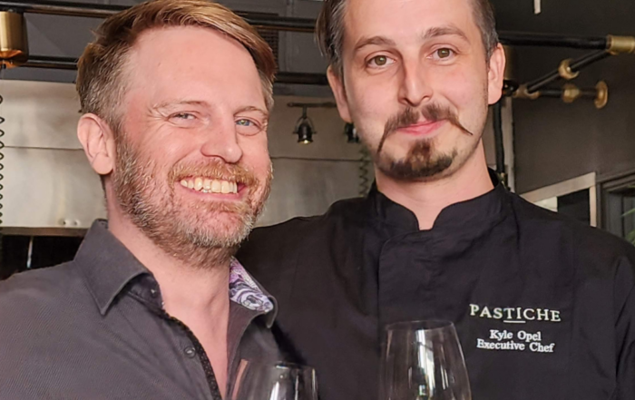 Jason Exton (left) and Chef Kyle Opel raise a glass at the opening of Pastiche in Bridgeland