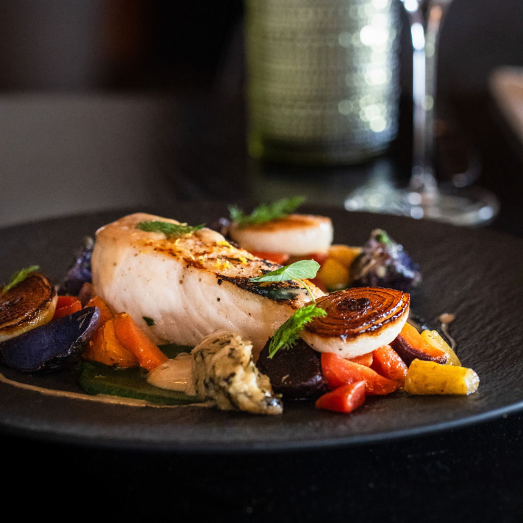 Chef Kevin Bourdages’ black cod with maitake mushrooms, purple bok choy, wasabi dressing and coconut foam